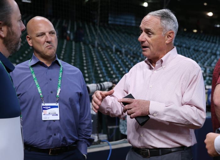 Oct 7, 2021; Houston, Texas, USA; MLB commissioner Rob Manfred (right) and chief revenue officer Noah Garden (left) in attendance before game one of the 2021 ALDS between the Houston Astros and the Chicago White Sox at Minute Maid Park. Mandatory Credit: Troy Taormina-USA TODAY Sports